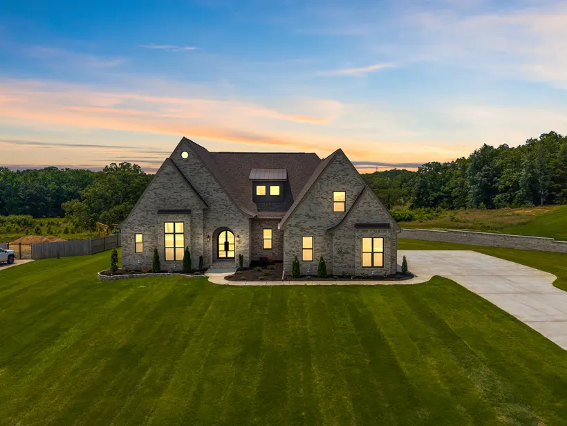 Stone home at dusk from above