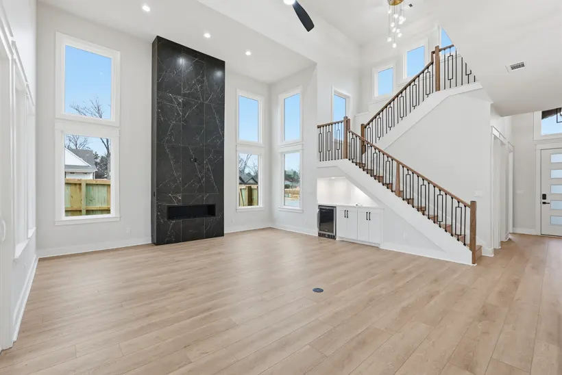 Living room with a tall fireplace